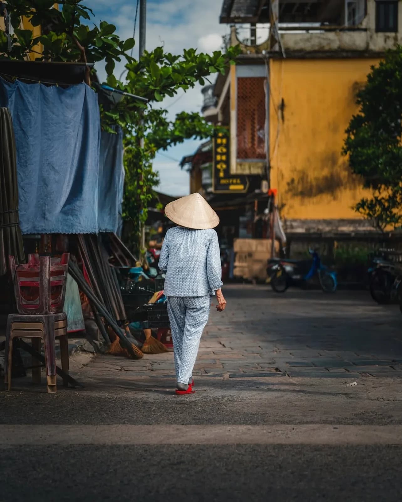 Weathered walls and silent glances in Hoi An
