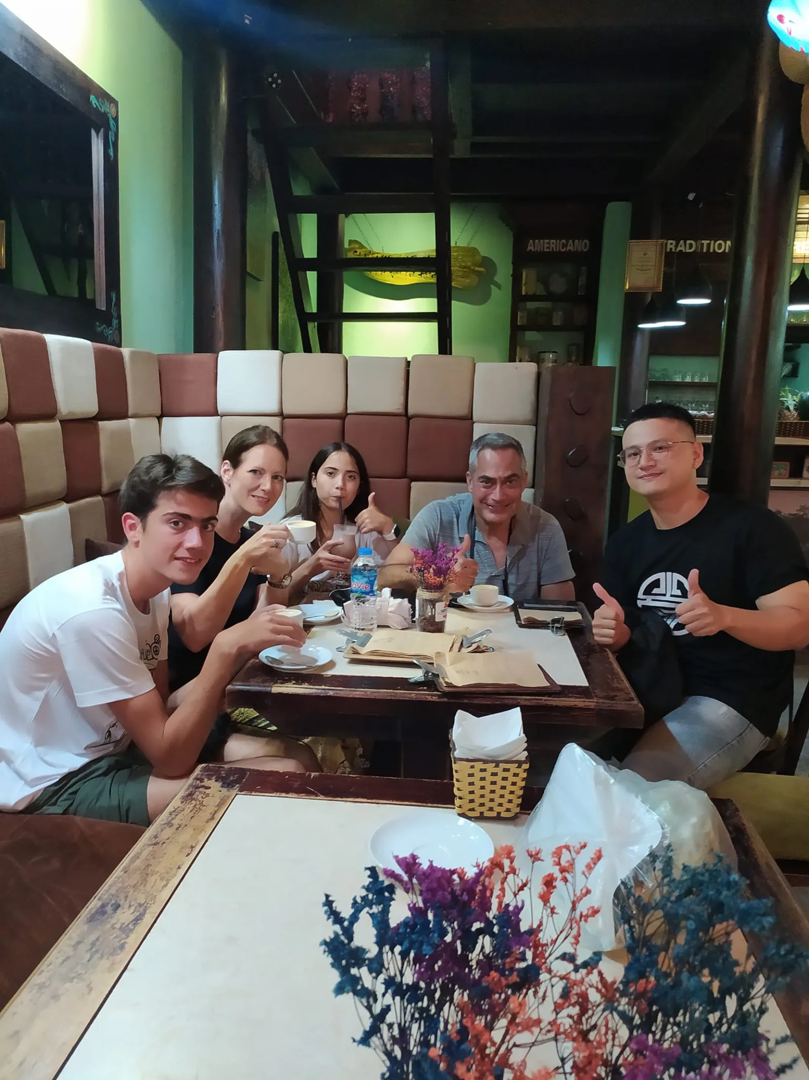 Fin joining guests for dinner during a private Hoi An food tour.