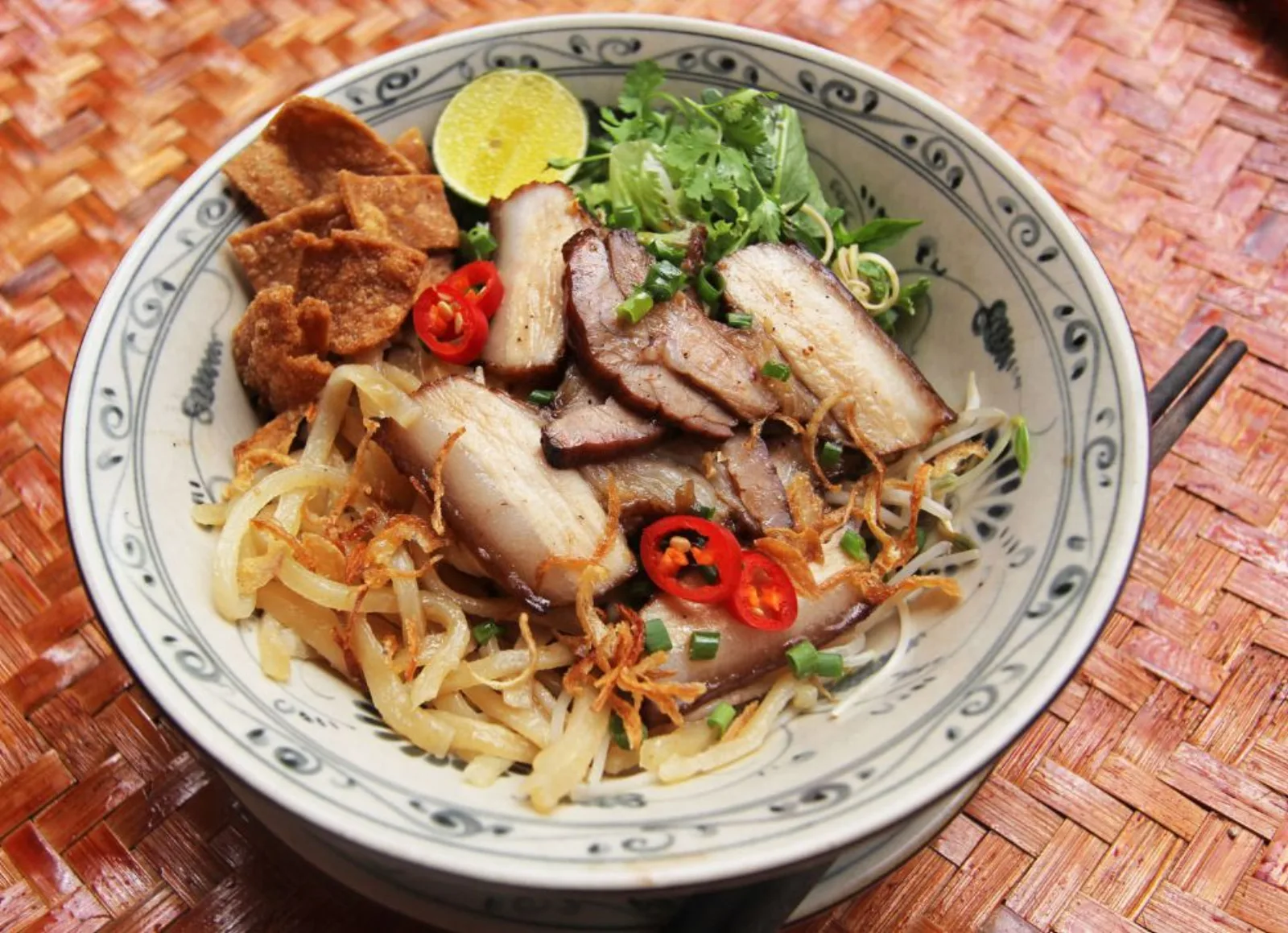 A bowl of cao lau, the Hoi An noodle dish made with water from the town's ancient Ba Le well.