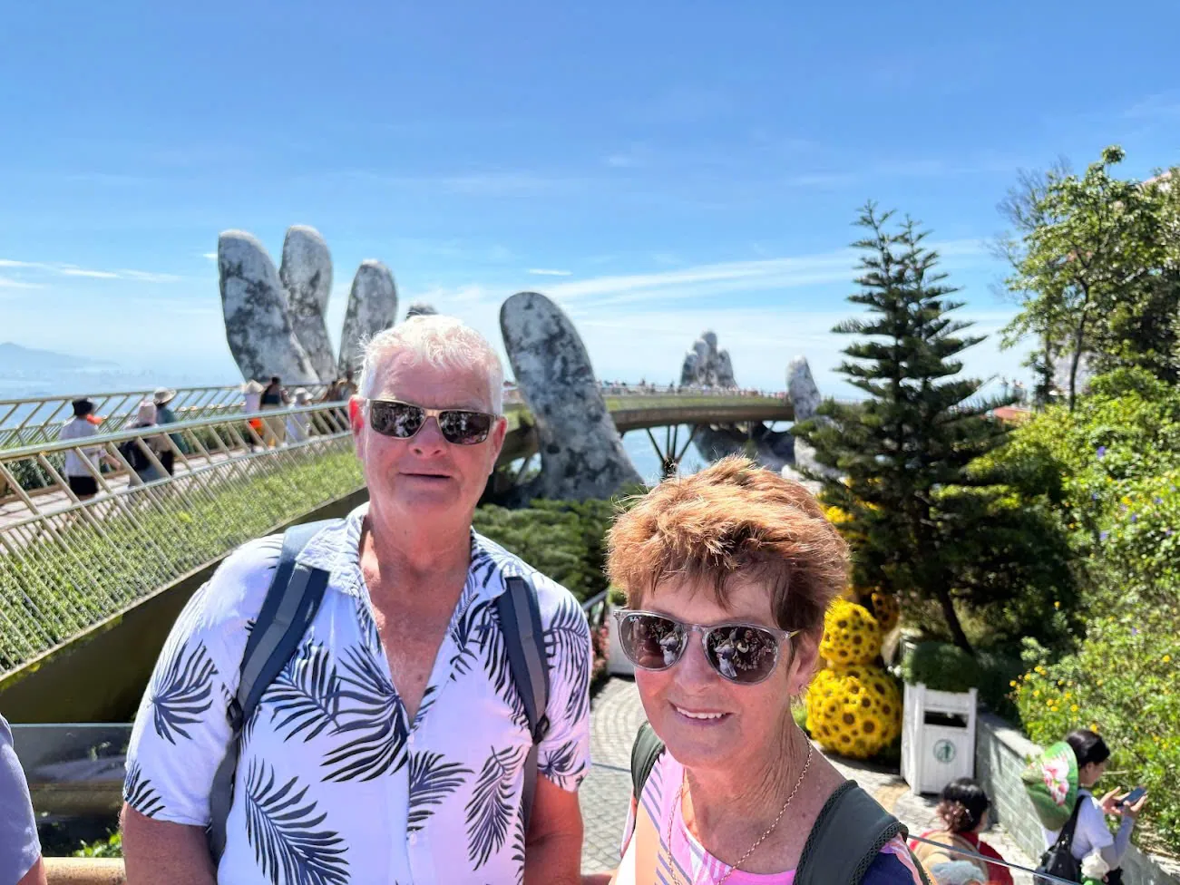 A couple at the Golden Bridge viewpoint near Da Nang during a private transfer with stops.