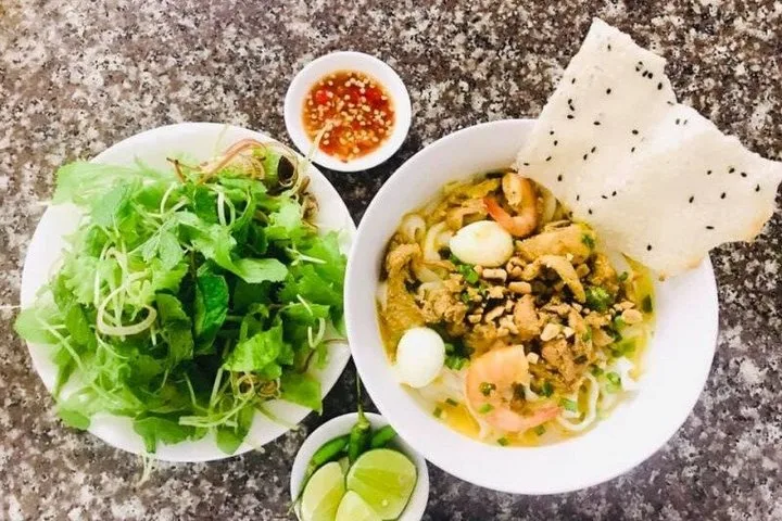 A bowl of mi quang served at the local restaurant stop on the My Son private tour.
