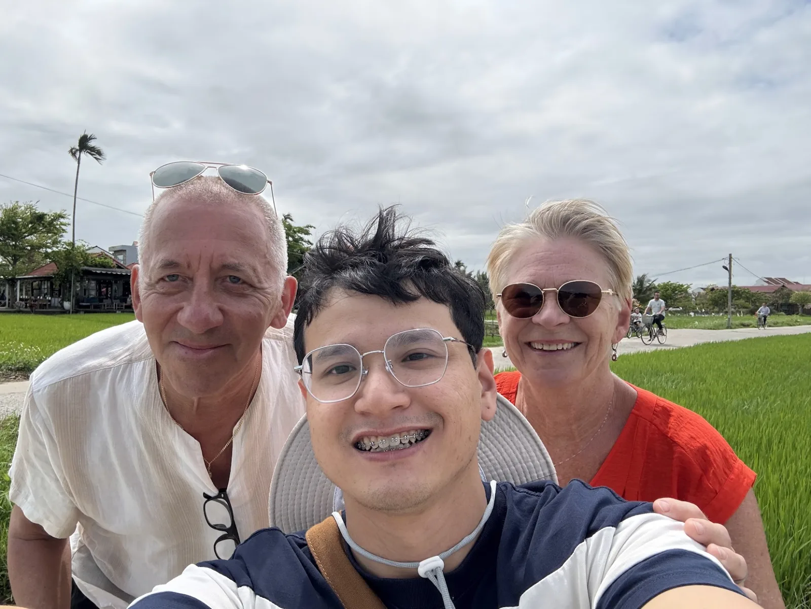 Fin taking a selfie with guests in the rice paddies outside Hoi An.